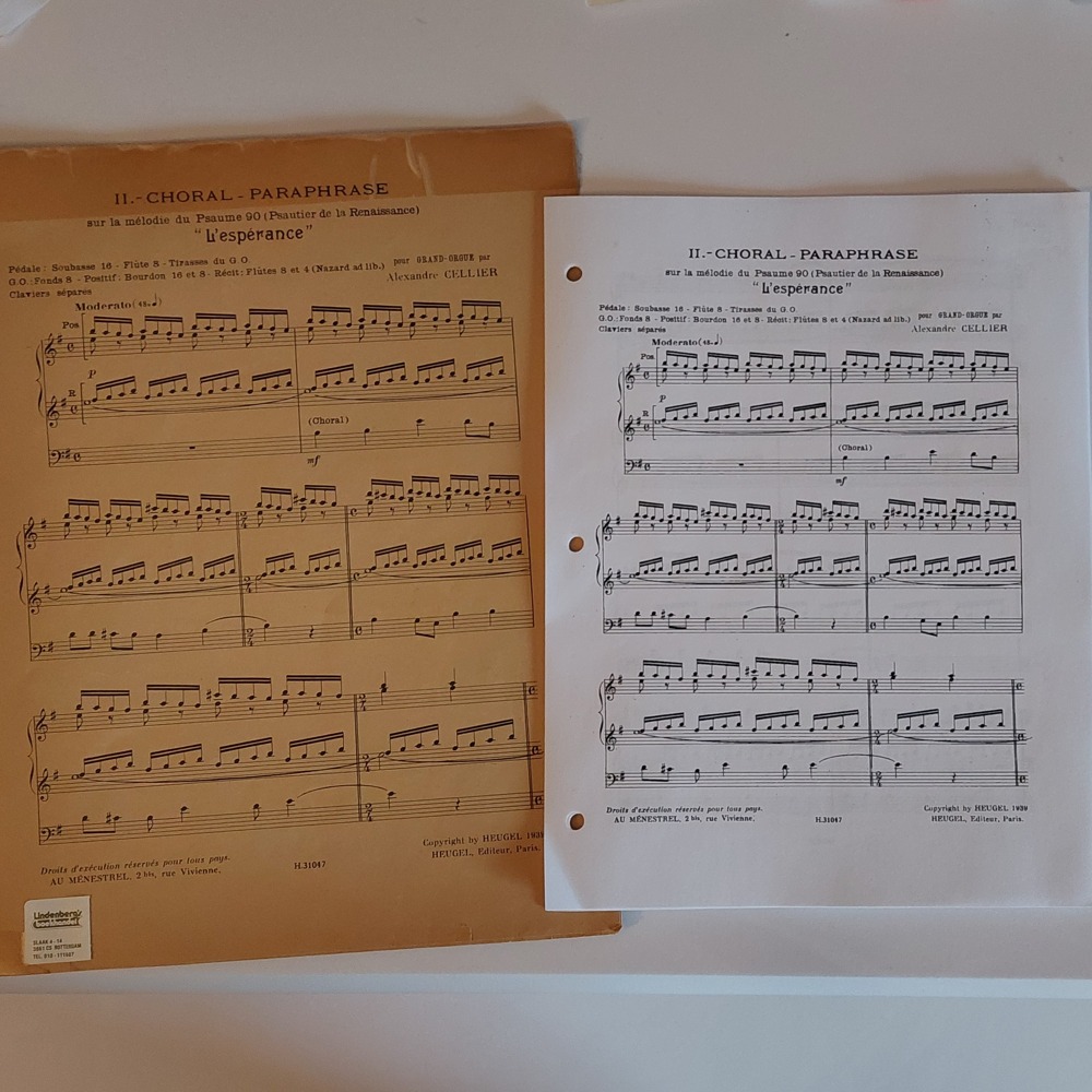 An old booklet of sheet music with yellowing pages next to newly printed pages of sheet music.